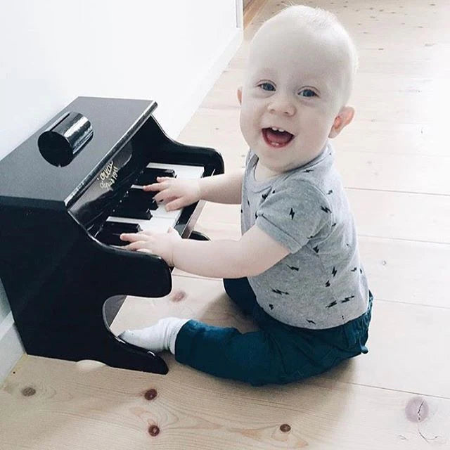 Black piano with scores