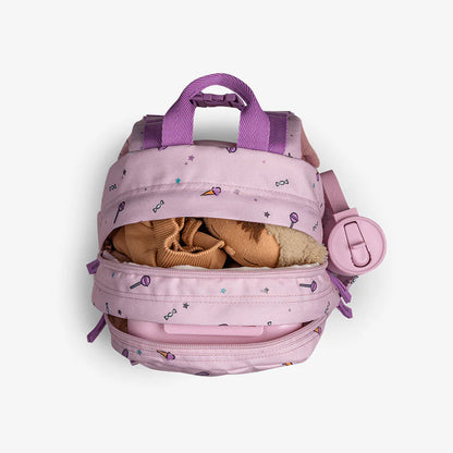 Pink backpack with teddy bear on a white background
