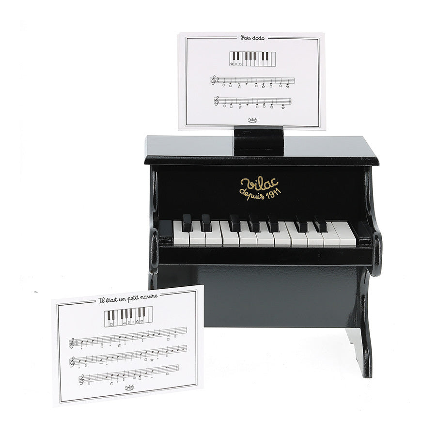 Black piano with scores