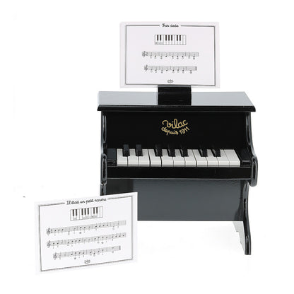 Black piano with scores
